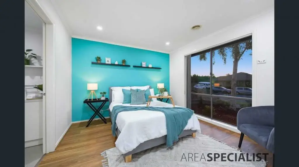 bedroom with blue backdrop